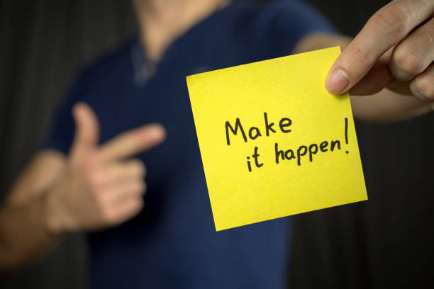istock Man holds yellow sticker inscription . 1046252232