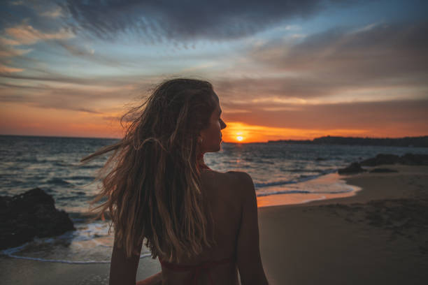 istock Young woman alone during sunset 1046252842