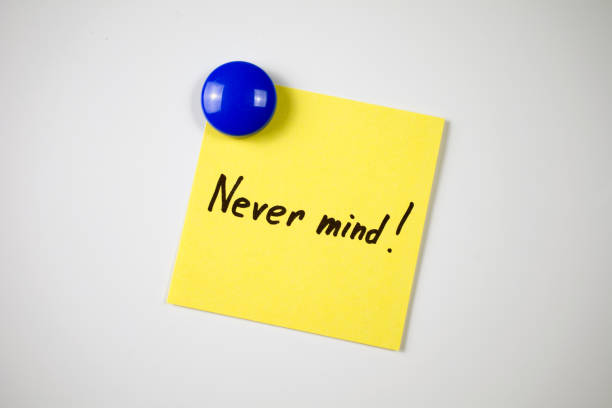 istock yellow sticker inscription Never mind! 1046255596