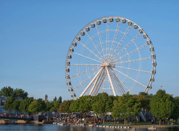 istock Montreal Observation Wheel in Old Montreal during a summer day 1046256072