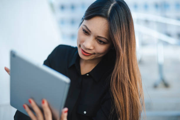 istock Businesswoman using digital tablet in the city 1046264076
