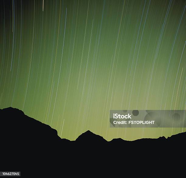Silhouette Of Mountain And Moving Stars Stock Photo - Download Image Now - Color Image, Digital Composite, Horizontal