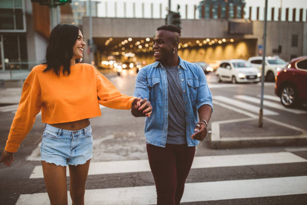 istock Happy Couple Passing The Street 1046274108