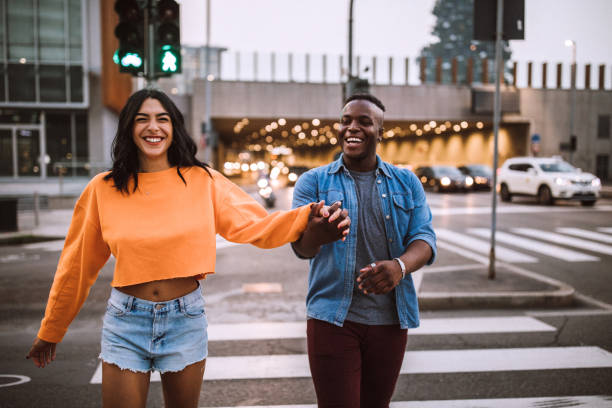 istock Happy Couple Passing The Street 1046276198