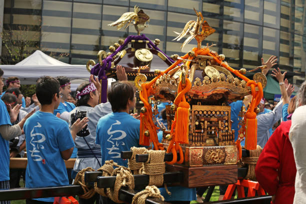 Tokyo- May 12 2024: people play the drum in Motomishima Shrine Festival in Arakawa, Tokyo. The procession of portable shrines from each of the clans and town councils passing in front of Shrine