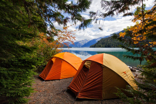 Two tents at Cheakamus Lake in autumn, BC, Canada stock photo