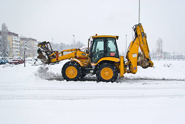 istock yellow snow plow cleaning a road 104629688