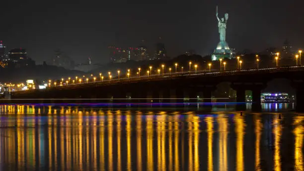 Reflection of the lights of a night city in the water.