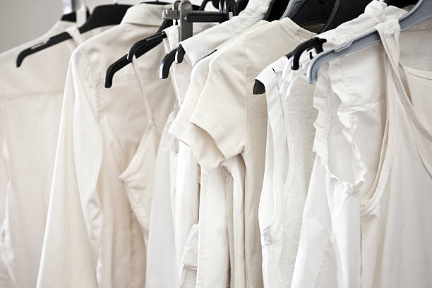 istock White cotton ladies tops on hangers 104631857