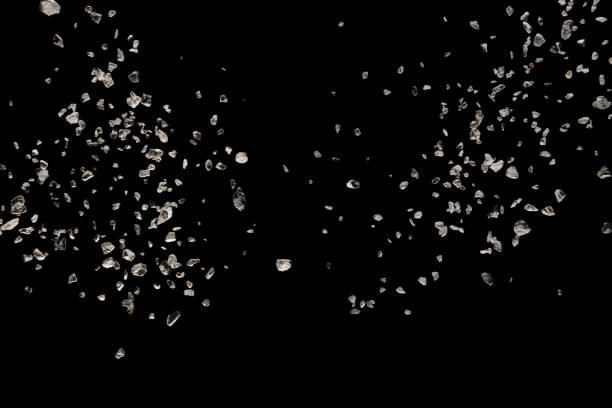 istock stones isolated on black background. Small granite rock stone fly isolated on black background. 1046321660