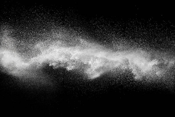 istock White talcum powder explosion splashing on black background. Use for web design or billboards abtract background. 1046321706