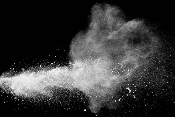 istock White talcum powder explosion splashing on black background. Use for web design or billboards abtract background. 1046321770