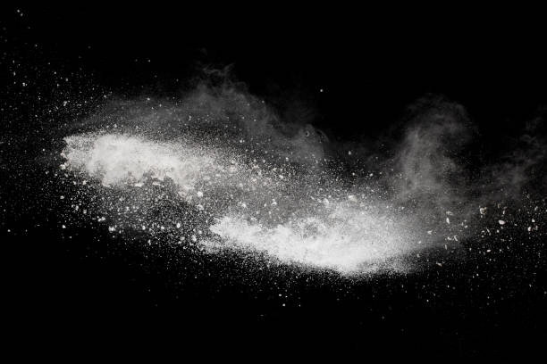 istock White talcum powder explosion splashing on black background. Use for web design or billboards abtract background. 1046321816