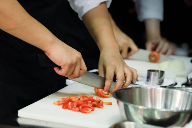 istock Chef preparing food, meal, in the kitchen, chef cooking, Chef decorating dish, closeup, chef at work 1046332212