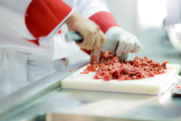 istock Chef preparing food, meal, in the kitchen, chef cooking, Chef decorating dish, closeup, chef at work 1046332506