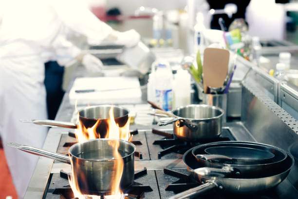 istock Chef preparing food, meal, in the kitchen, chef cooking, Chef decorating dish, closeup, chef at work 1046332536