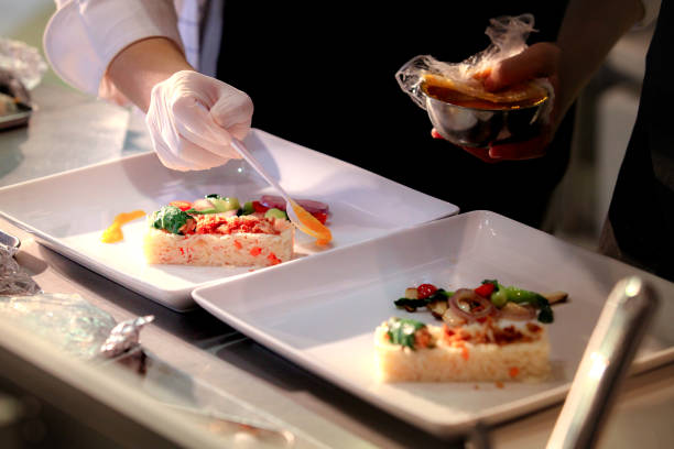 istock Chef preparing food, meal, in the kitchen, chef cooking, Chef decorating dish, closeup, 
chef at work 1046332550