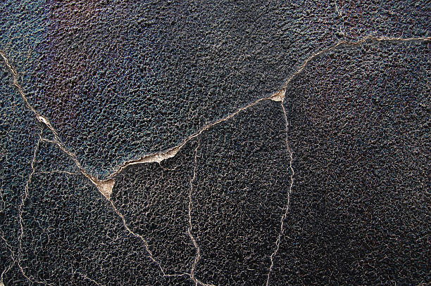 cracks in a grungy wall stock photo