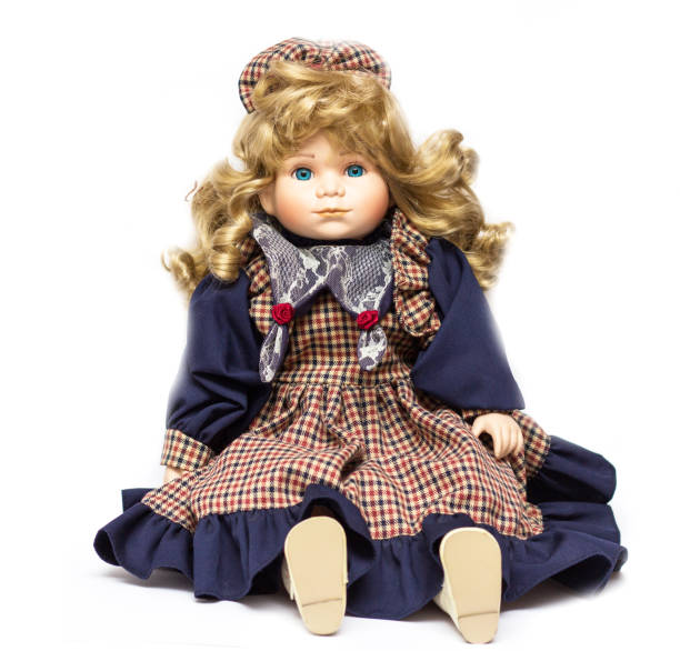 istock Old porcelain doll on White Background. Concept of time. 1046349272