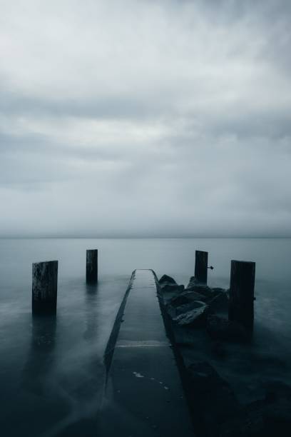 istock Fog On Dark Waters Edge Photo 1046355182