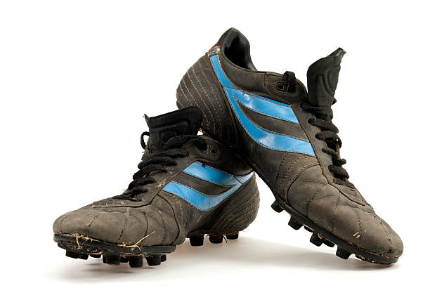 old soccer shoes old football boots still dirty grass cleats stock pictures, royalty-free photos & images