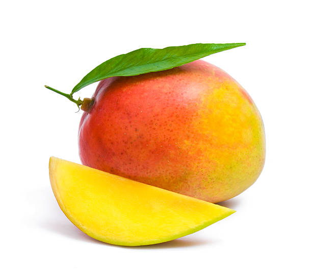 istock A slice of mango next to a whole mango on a white background 104636314