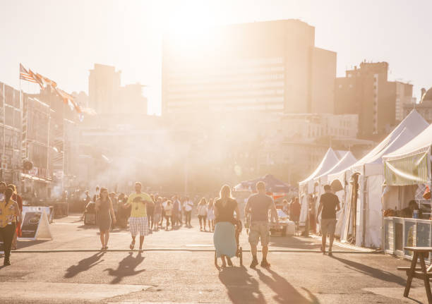 September 14th 2018,Montreal,Canada: Tourists and locals having good time in an amusement park by the St.Lawrence River in Montreal,Canada.Food trucks and cityscape can be seen in the backgrounds.