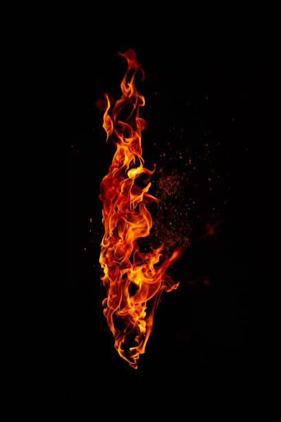 огненный факел изолирован на черном фоне - outdoor fire фотографии стоковые фото и изображения