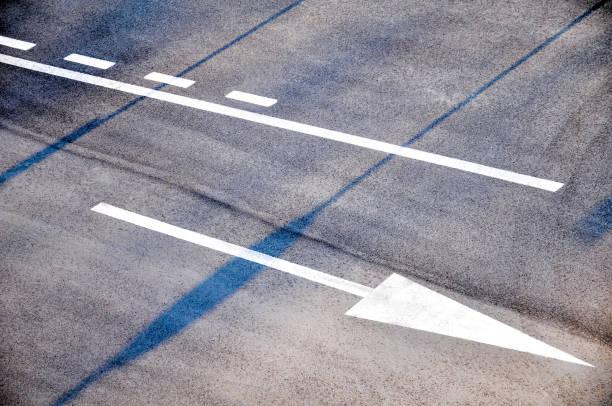 istock Arrows on an asphalt road 1046369558