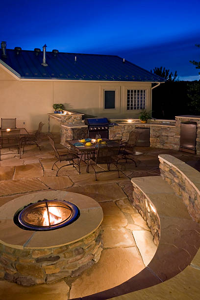 Backyard at dusk with fire pit stock photo