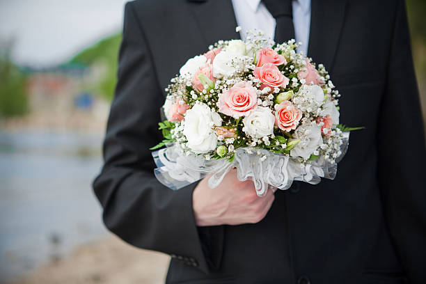 istock Wedding bouquet in a groom's hand 104637519