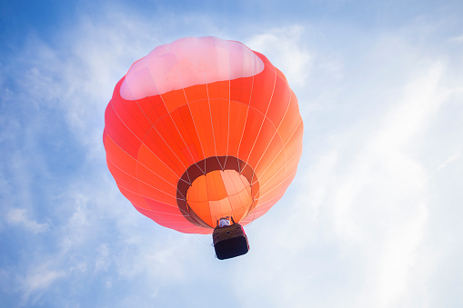 Low angle view of a red hot air baloon.