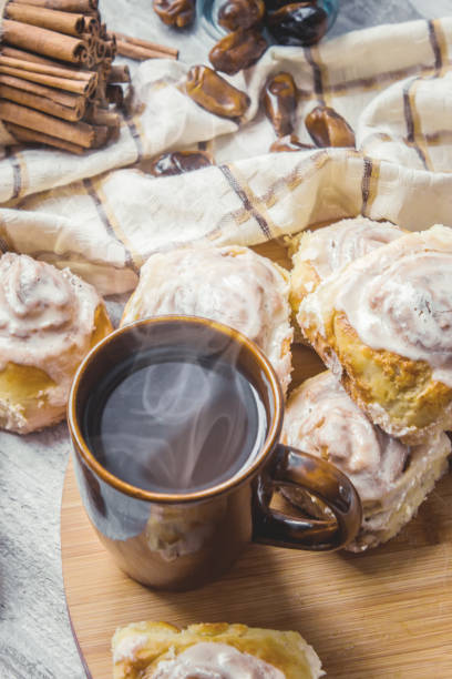 istock Cinnabon cinnamon and cream for tea. Selective focus. 1046383546