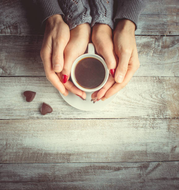 istock Hot coffee in the hands of a loved one. 1046391396