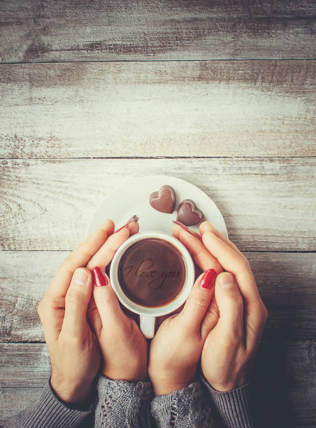 istock Hot coffee in the hands of a loved one. 1046393530