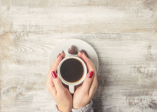 istock Hot coffee in the hands of a loved one. 1046393672
