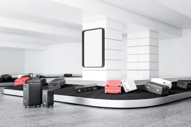 istock Suitcases on airport conveyor belt, poster 1046398094