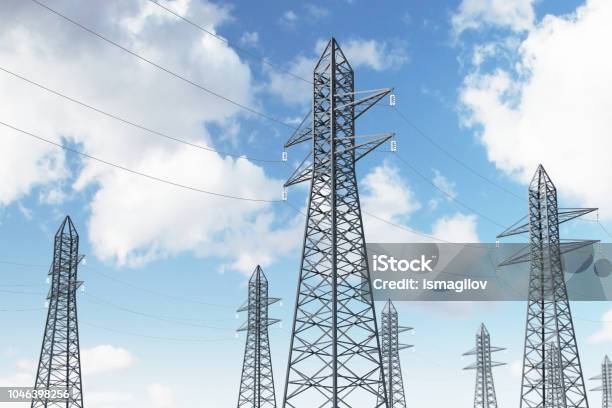 Row Of Power Line Supports Against Blue Sky Side Stock Photo - Download Image Now - Blue, Cable, Connection