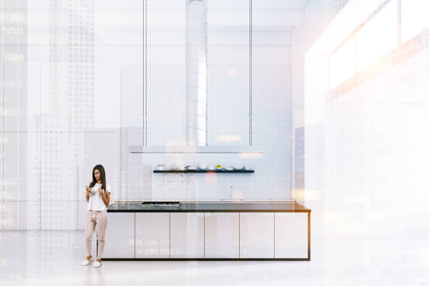 istock White industrial style kitchen, woman 1046400622
