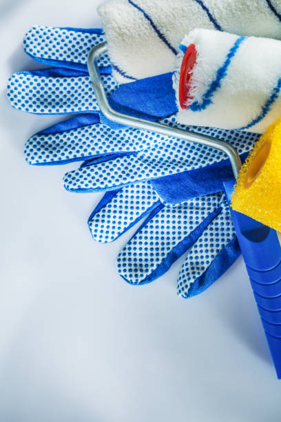 istock Set of safety gloves paint rollers on white background 1046400728