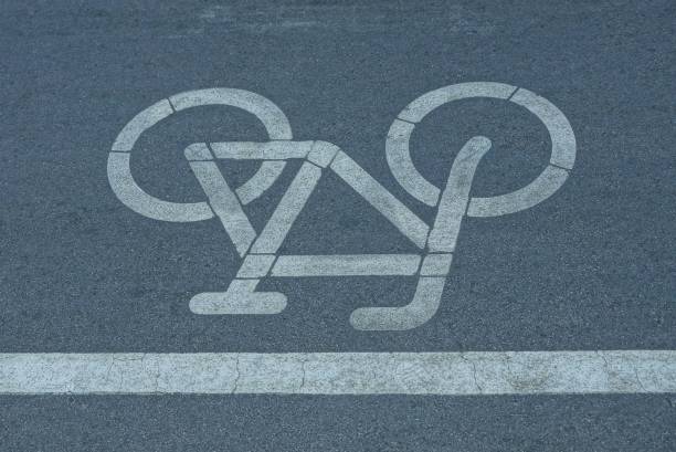 istock road sign from a white line and a bicycle on the asphalt 1046401278