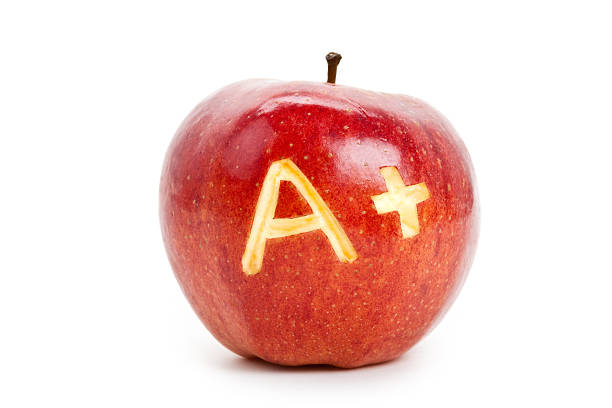 Red apple and A Plus sign  report card stock pictures, royalty-free photos & images