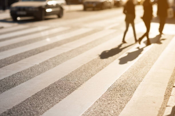 istock Pedestrians on zebra crossing, diminishing perspective into bright light, tilt shift 1046412714