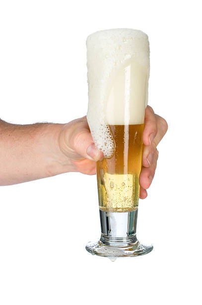 istock Man holding glass of beer 104641350