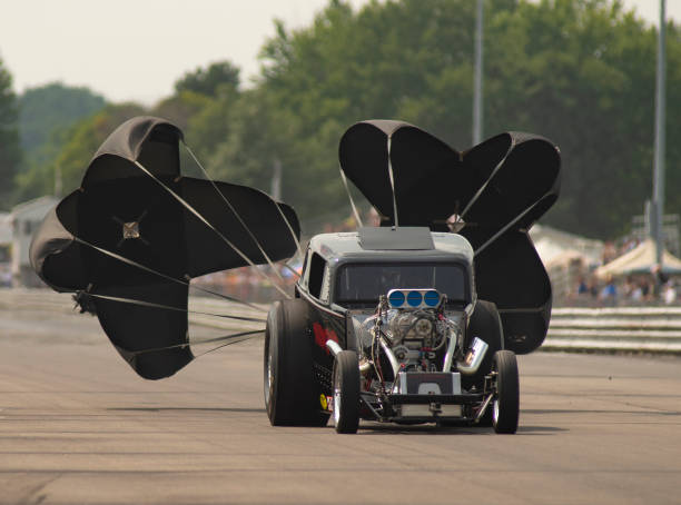 Nimrod Fuel Altered Car Slows After Drag Race The dual black chutes match the Nimrod car on the track drag racing stock pictures, royalty-free photos & images