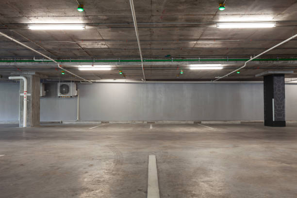 istock Parking garage interior, industrial building,Empty underground interior in apartment or in supermarket 1046427994
