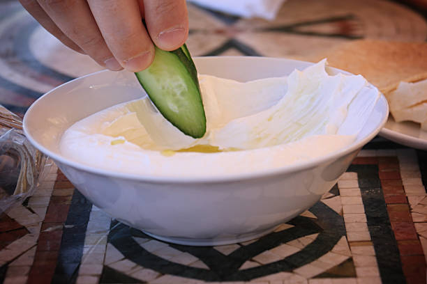 istock Dipping Cucumber in Labneh 1046431144