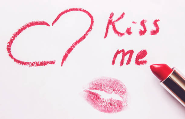 a kiss on a white background lipstick. selective focus.