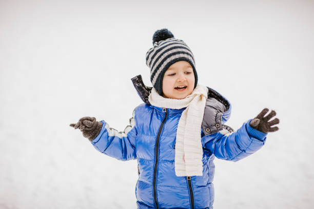 istock Cute little boy on snow 1046438988