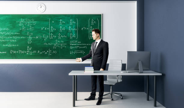 istock Businessman with algebra formulas 1046439476